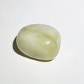 Jade tumble stone on a white background