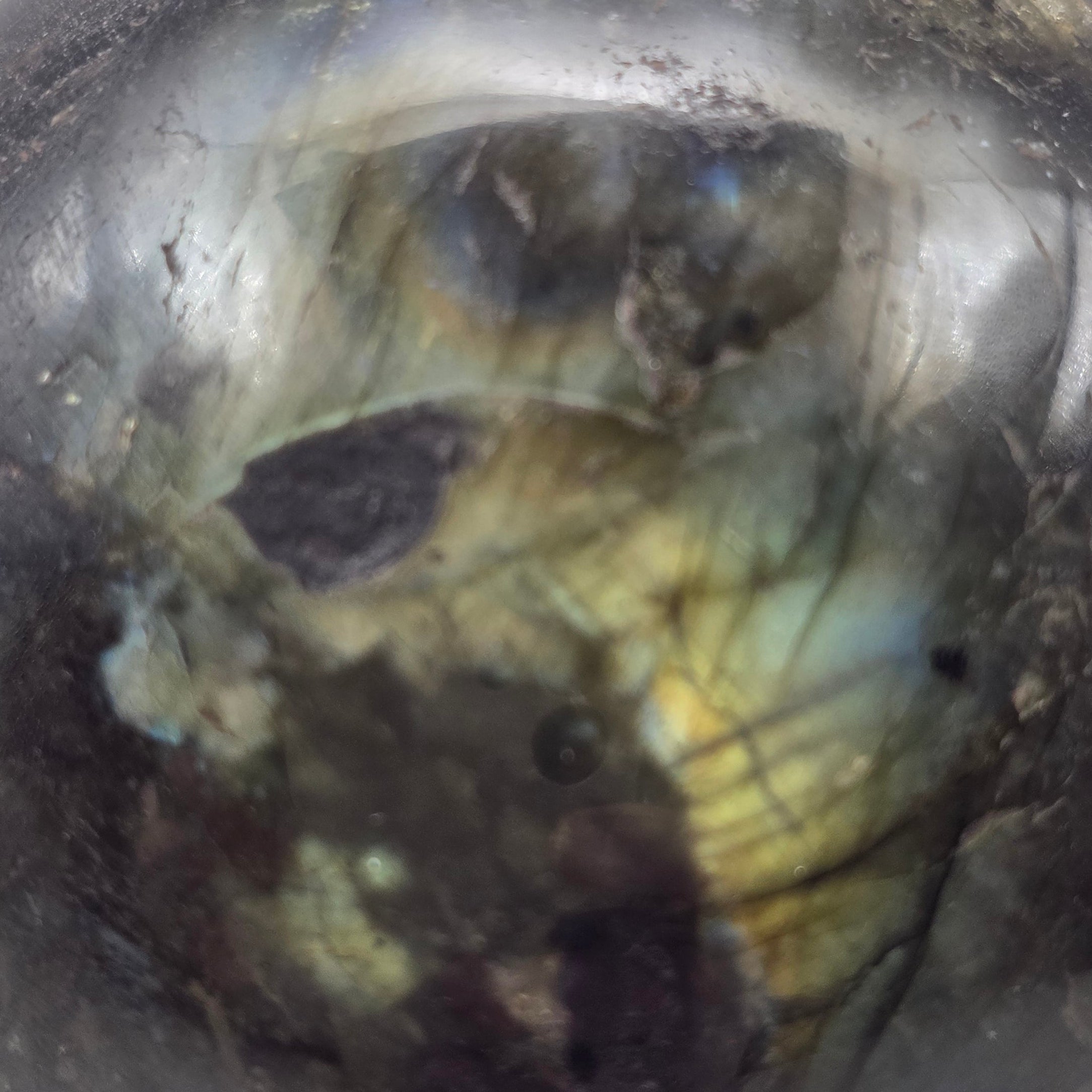 Close-up of a Labradorite shpere with internal inclusions