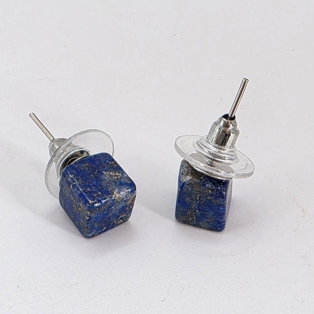Two Lapiz earrings on a white background