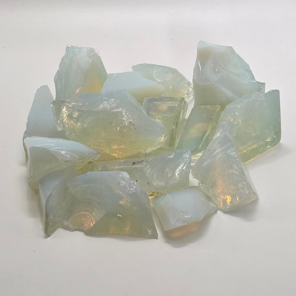 Group of opalite raw crystals on a white background
