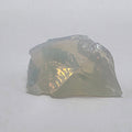 Fragment of raw opalite on a white background