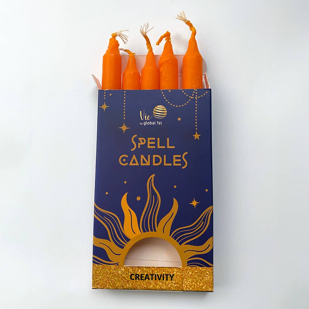 Pack of orange spell candles with a blue box labeled 'Creativity' on a white background