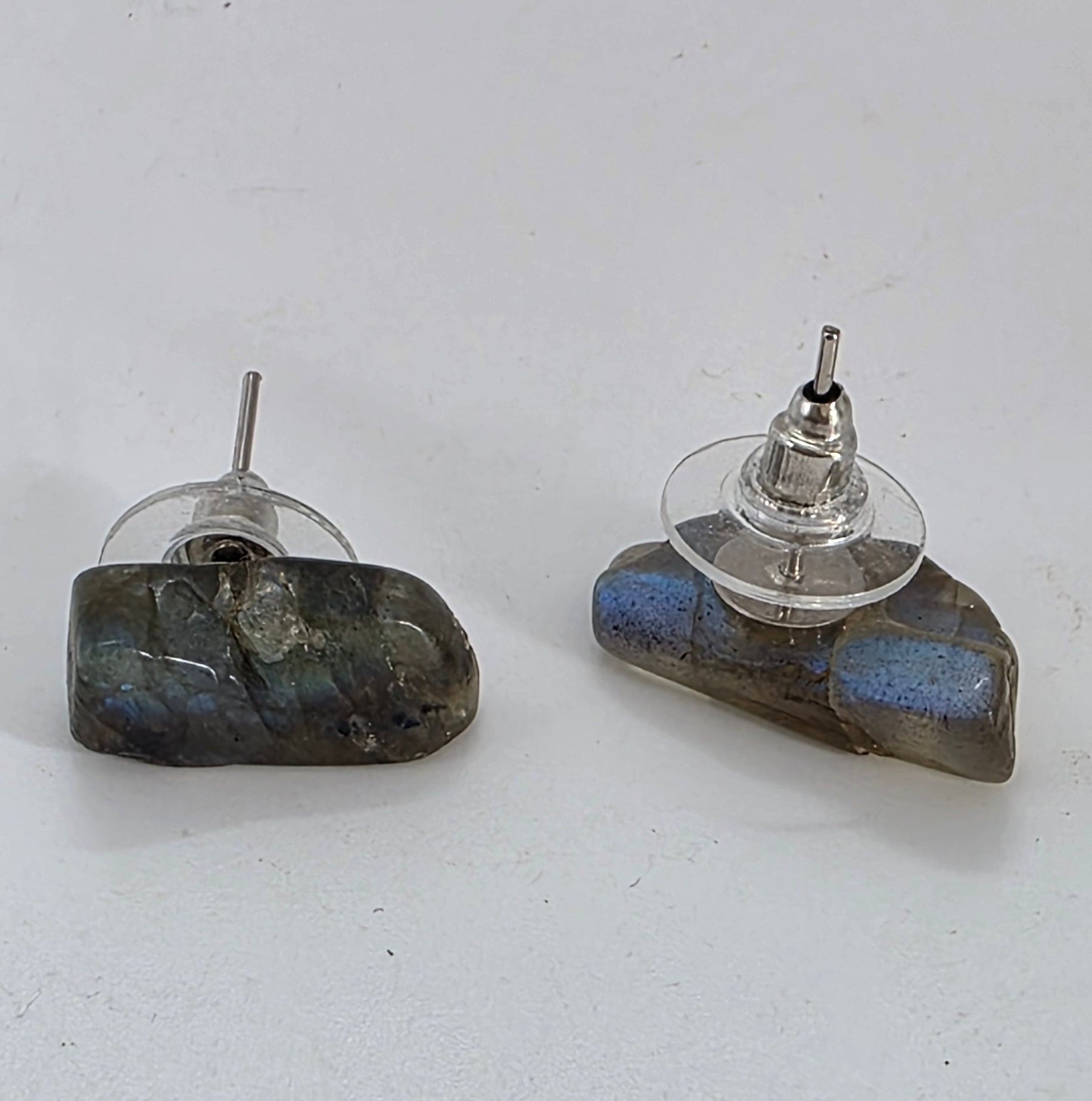 Two Labradorite earrings on a white background