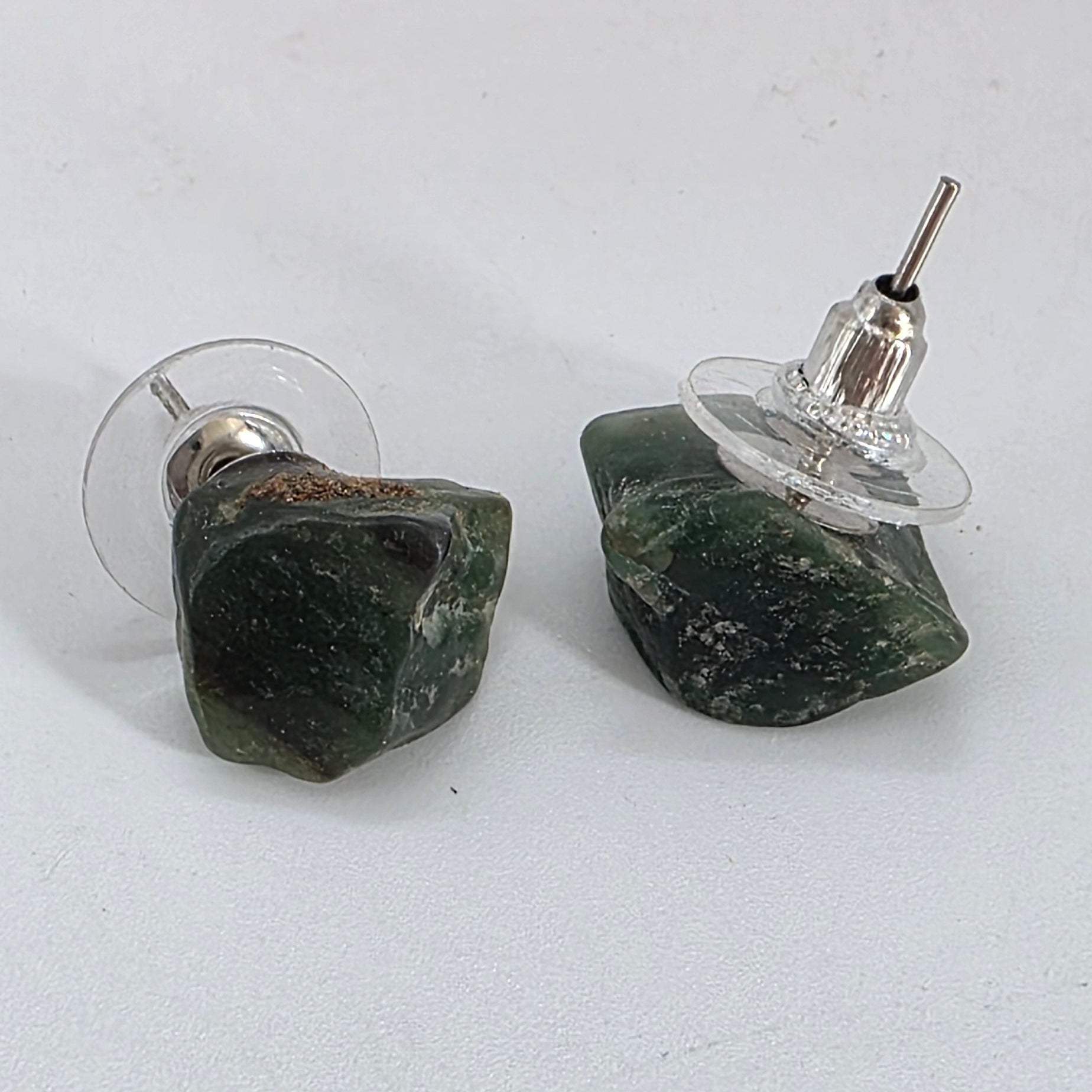 Pair of green aventurine earrings on a white background