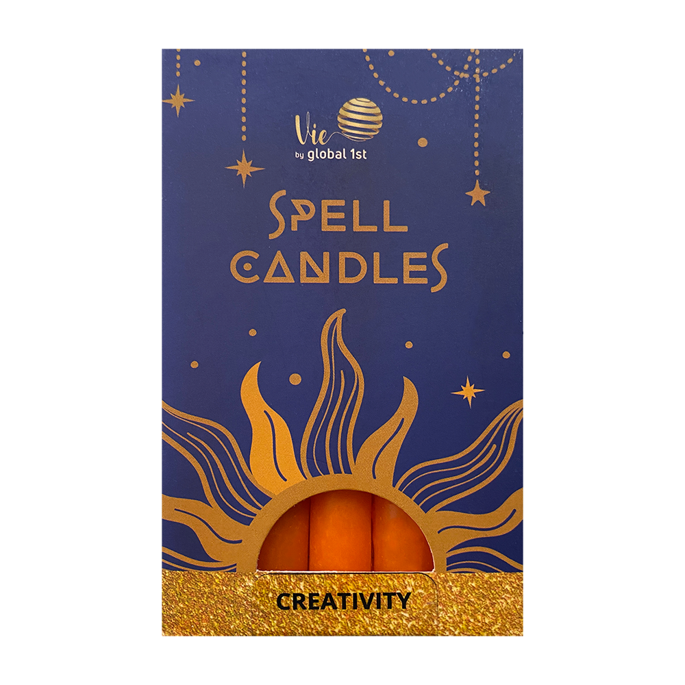 Box of spell candles with gold text and design on a blue background