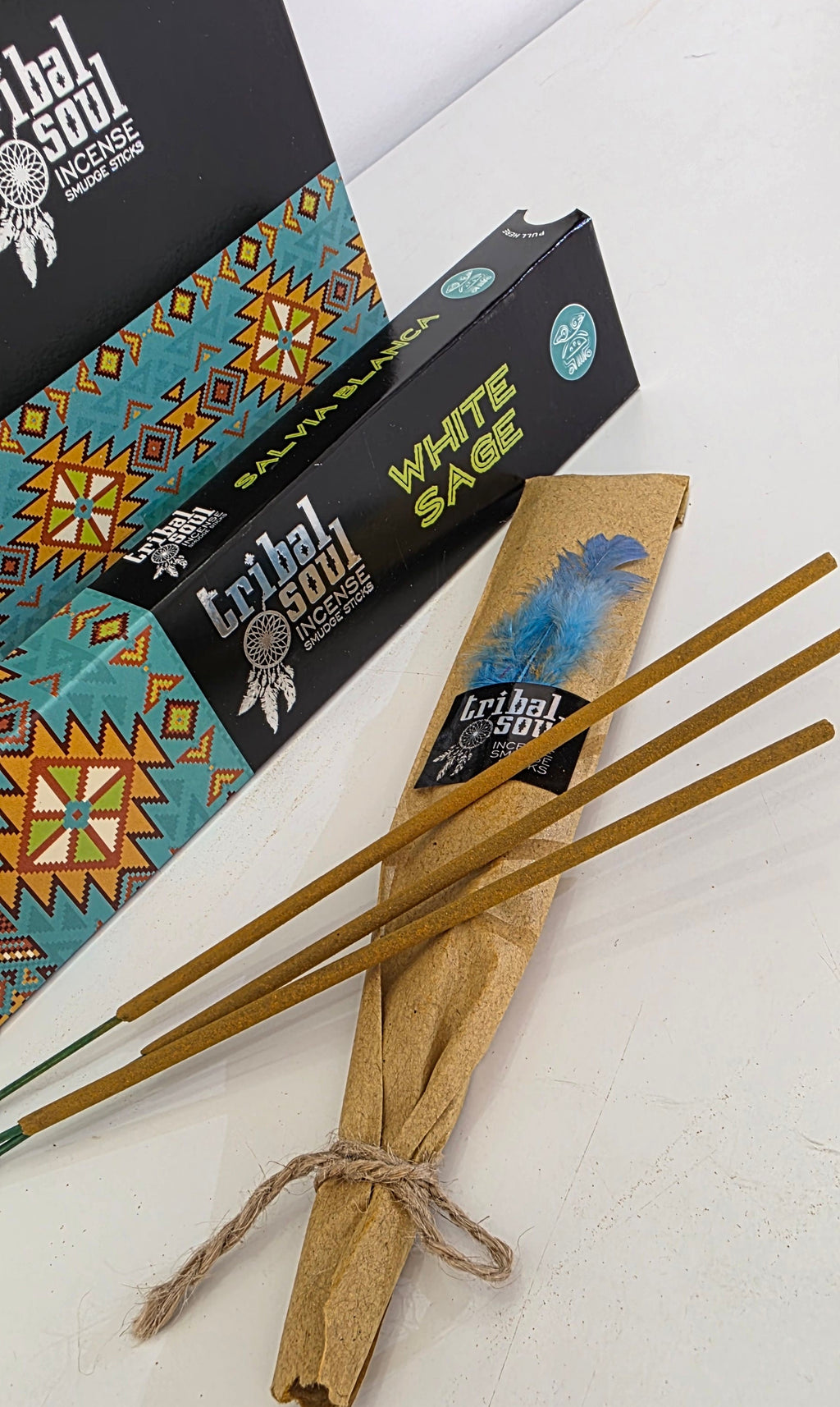 White sage incense sticks removed from packet showing individual joss sticks on pack with a white background