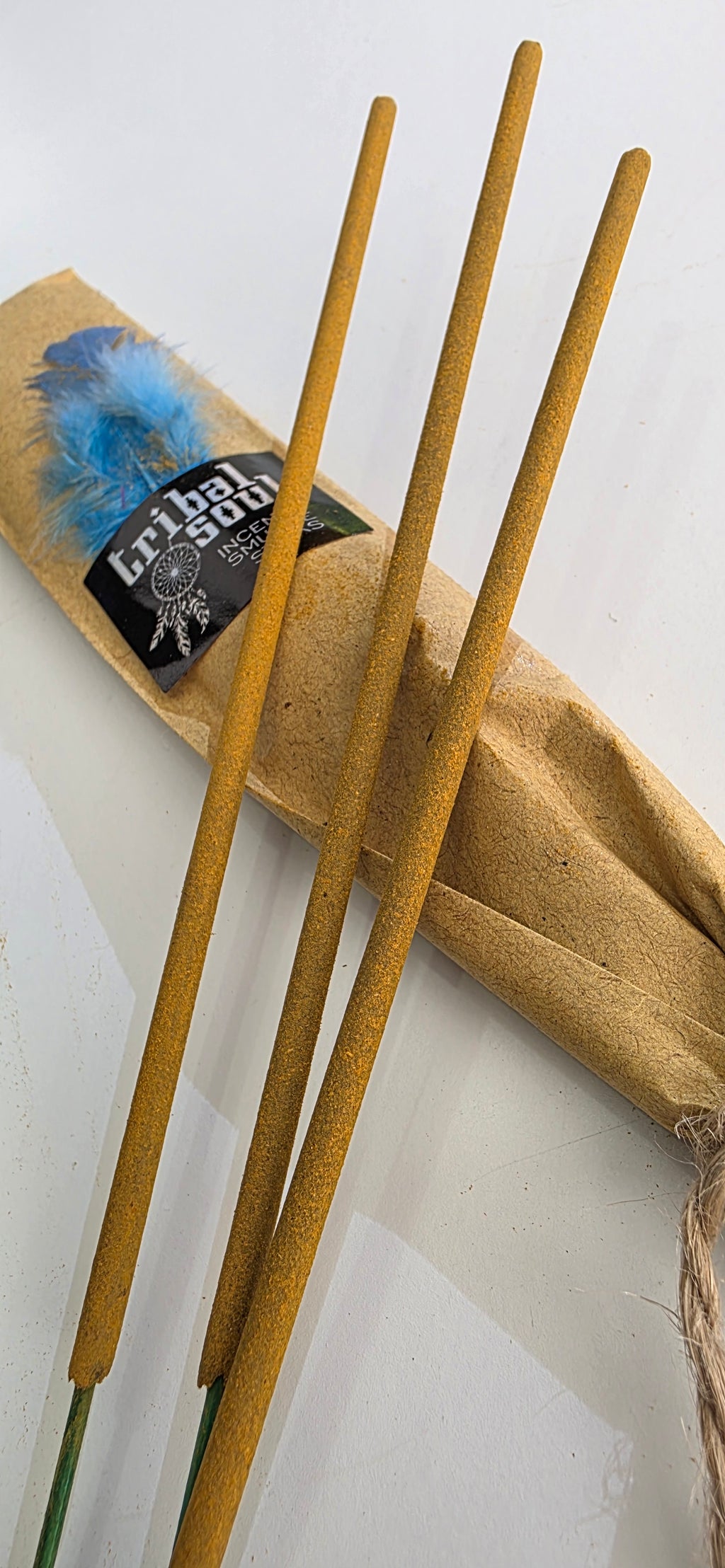 Incense sticks with a kraft paper package on a white background