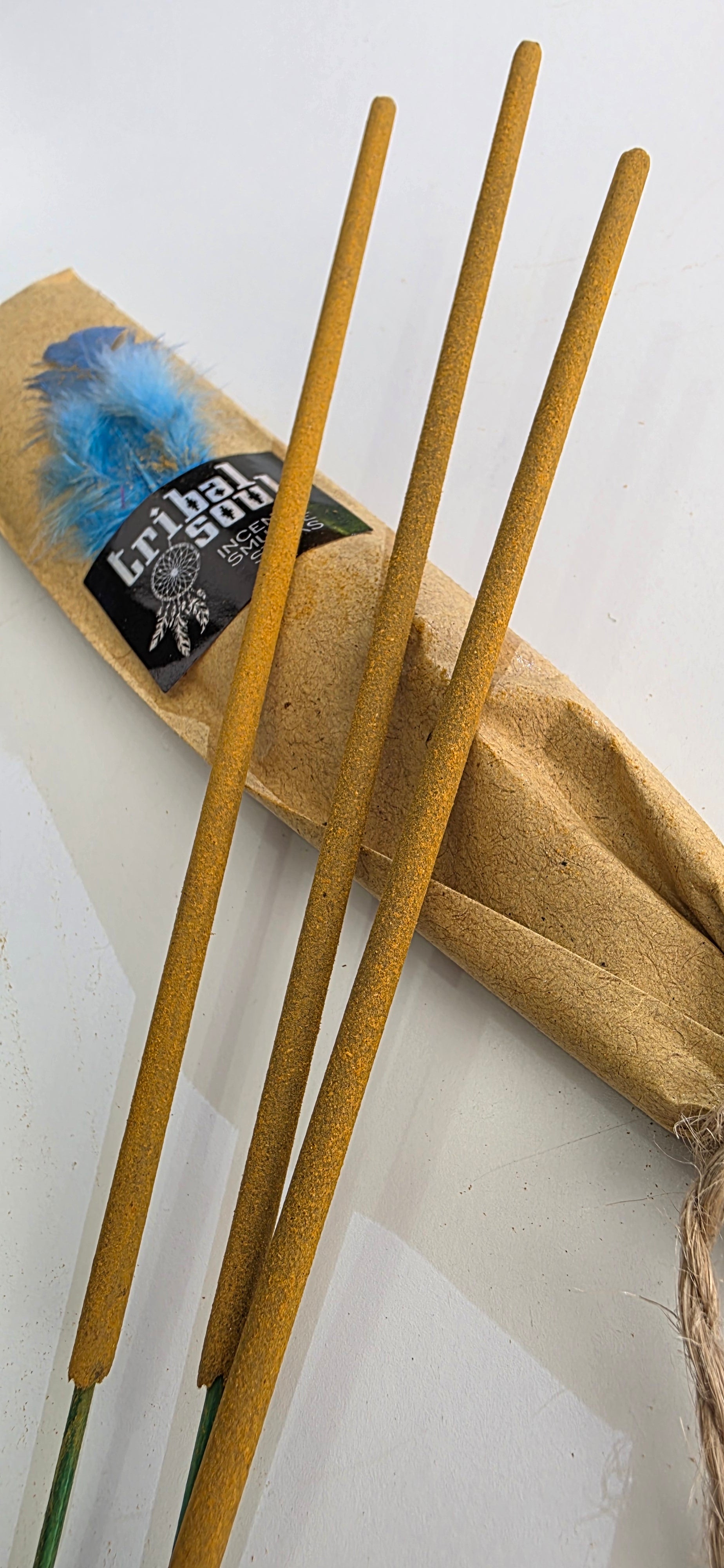 Incense sticks with a kraft paper package on a white background