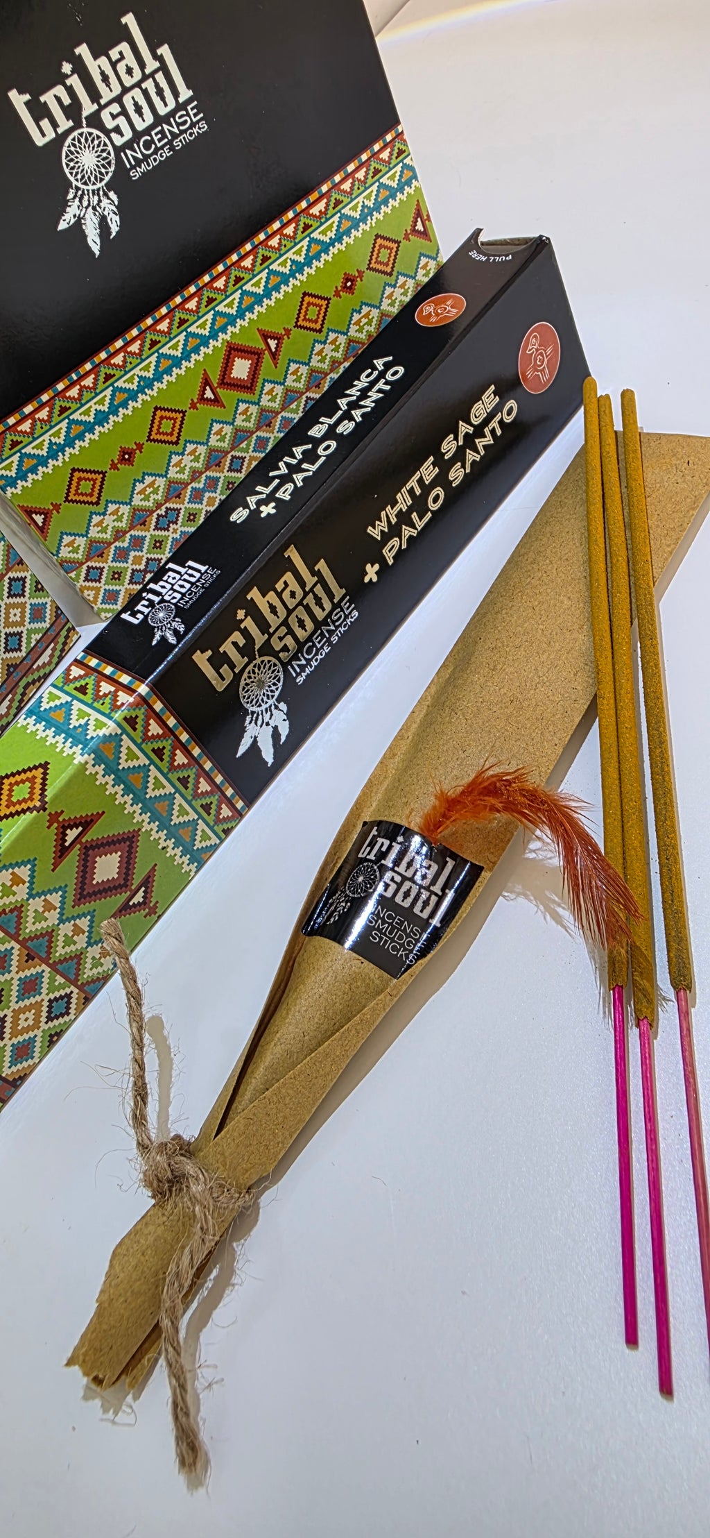 White sage incense sticks removed from packet showing individual joss sticks on insert packaging with a white background