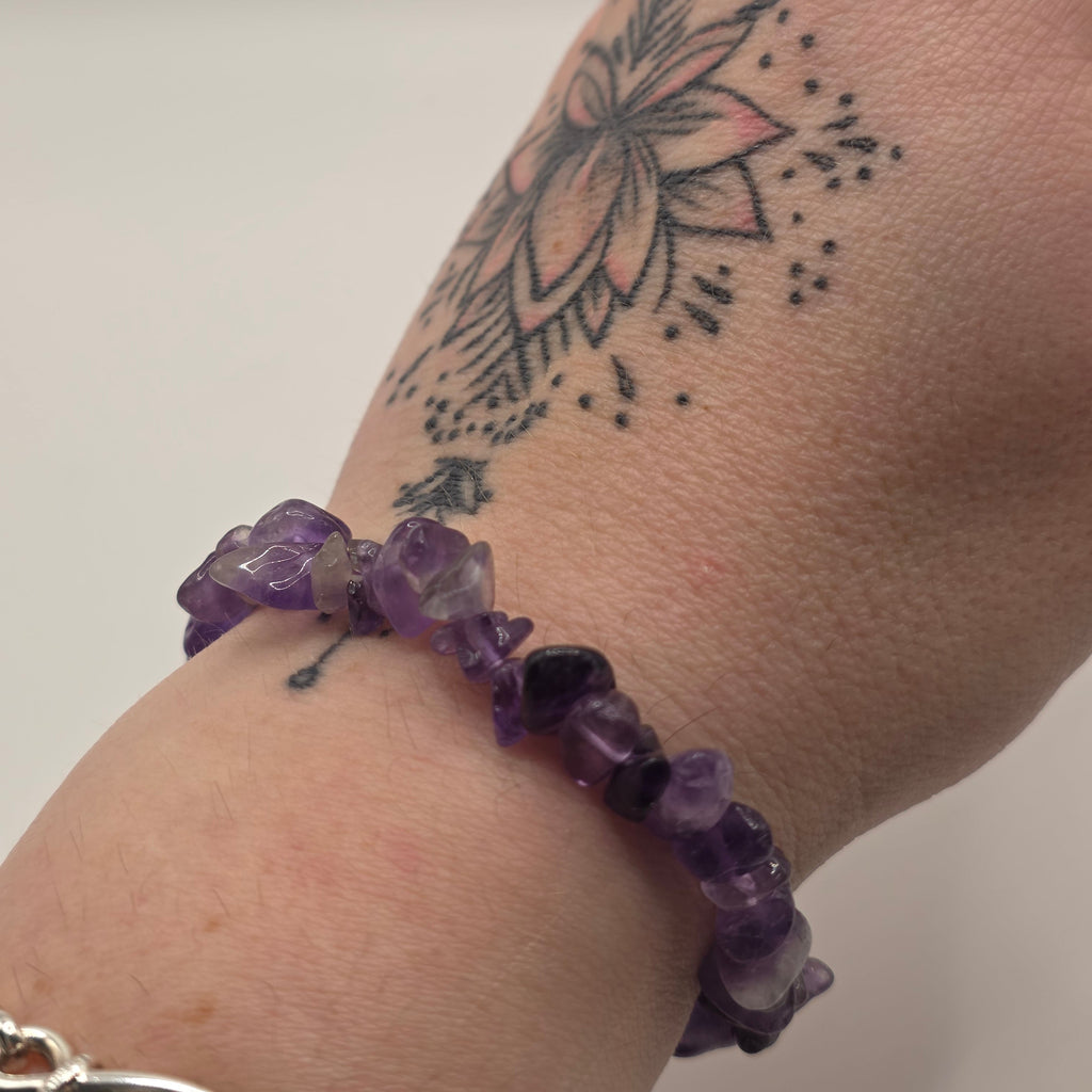 Amethyst chip bracelet worn on a wrist – double strung elastic stretch bracelet for crystal healing on the go