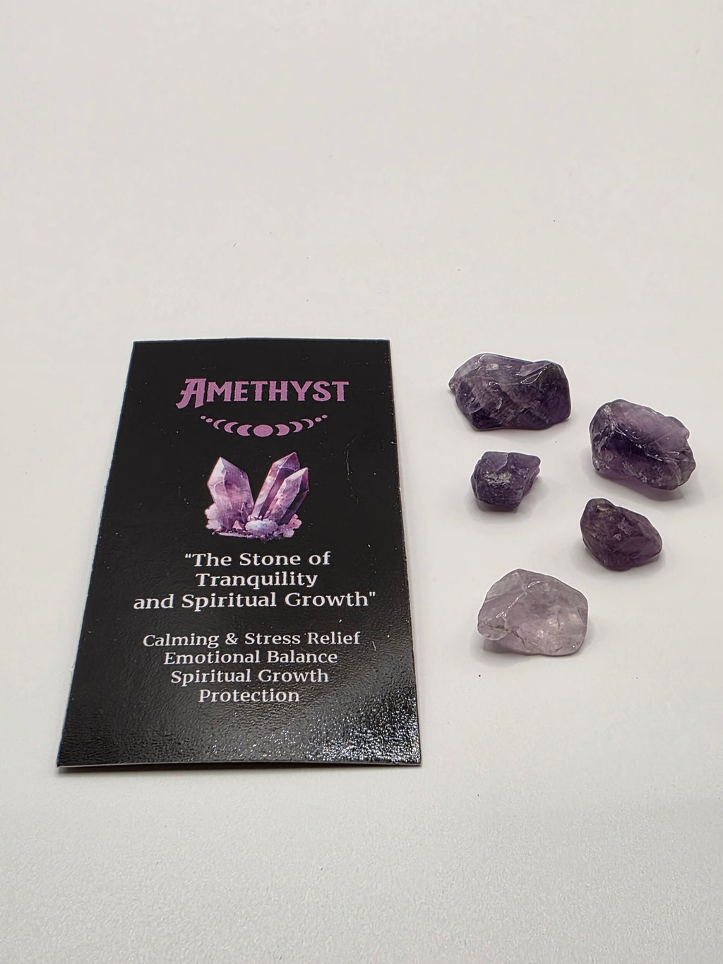 Mini amethyst crystals and information card included with the incense – small tumbled stones for calm and spiritual awareness