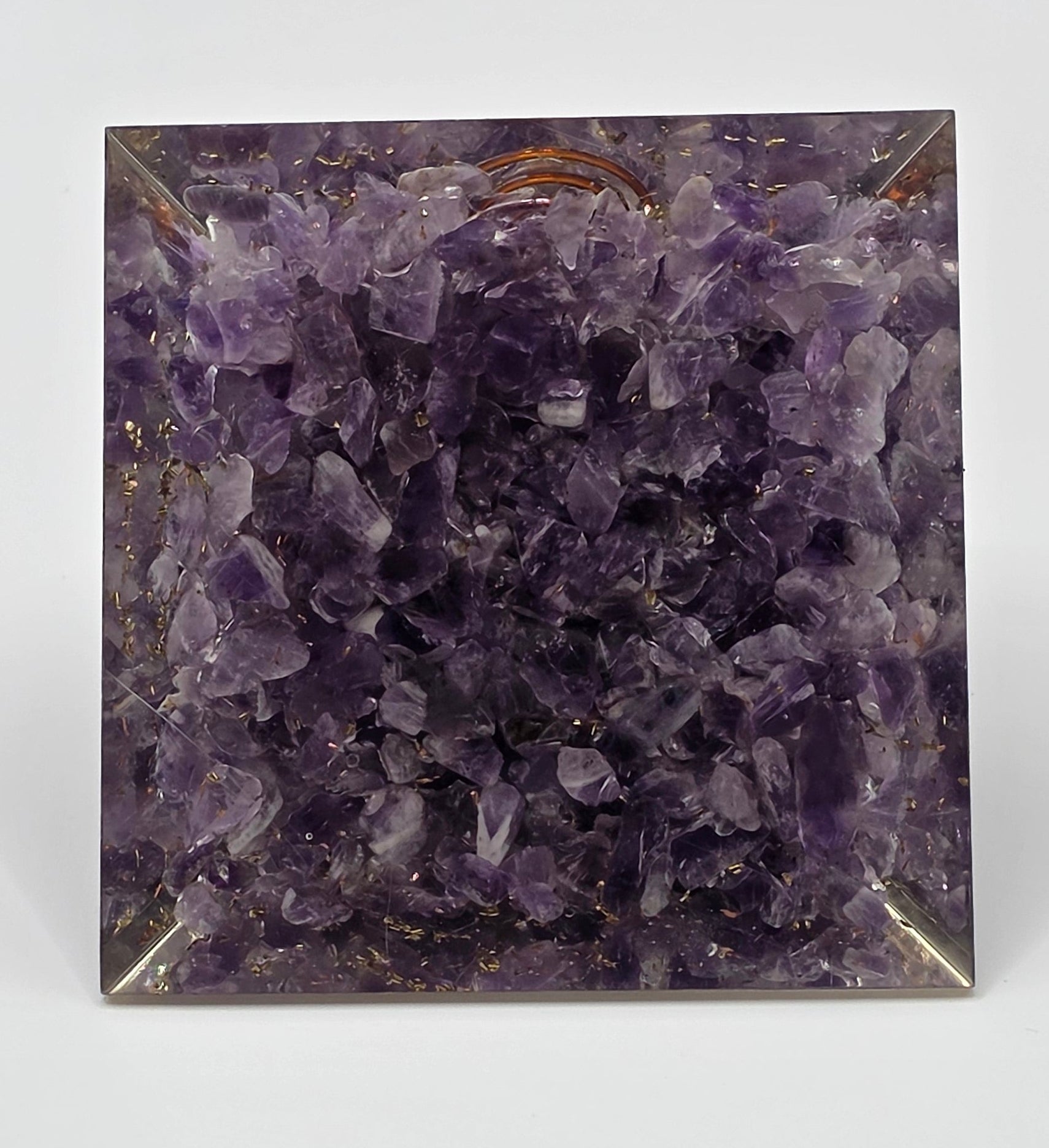 Basw view of amethyst orgonite pyramid 60mm showing the bottom layer of the amethyst chips