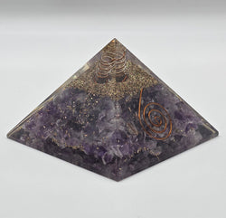 Amethyst orgonite pyramid 60mm on white background – purple crystal pyramid for calm and EMF protection