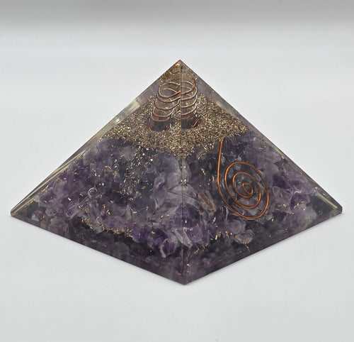 Amethyst orgonite pyramid 60mm on white background – purple crystal pyramid for calm and EMF protection