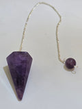 Amethyst faceted pendulum with silver plated chain on white background