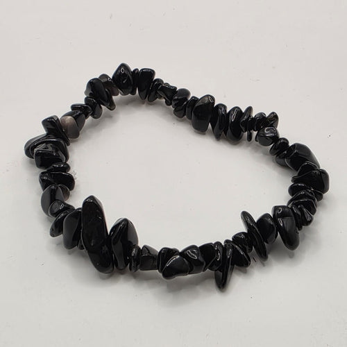 Black obsidian chip bracelet on white background – natural volcanic glass chips for protection and grounding
