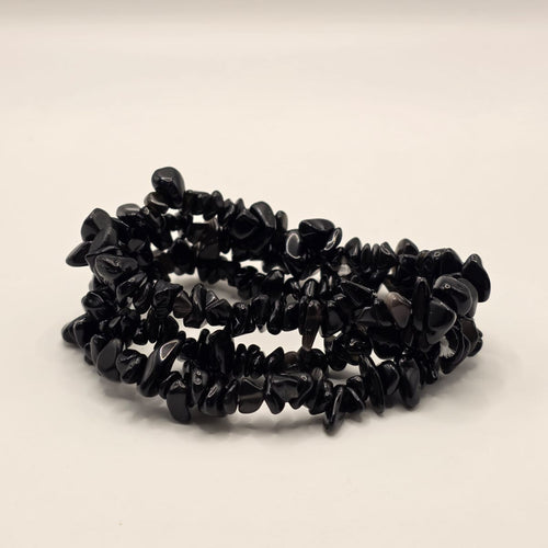 3 Black obsidian chip bracelets on white background – natural volcanic glass chips for protection and grounding