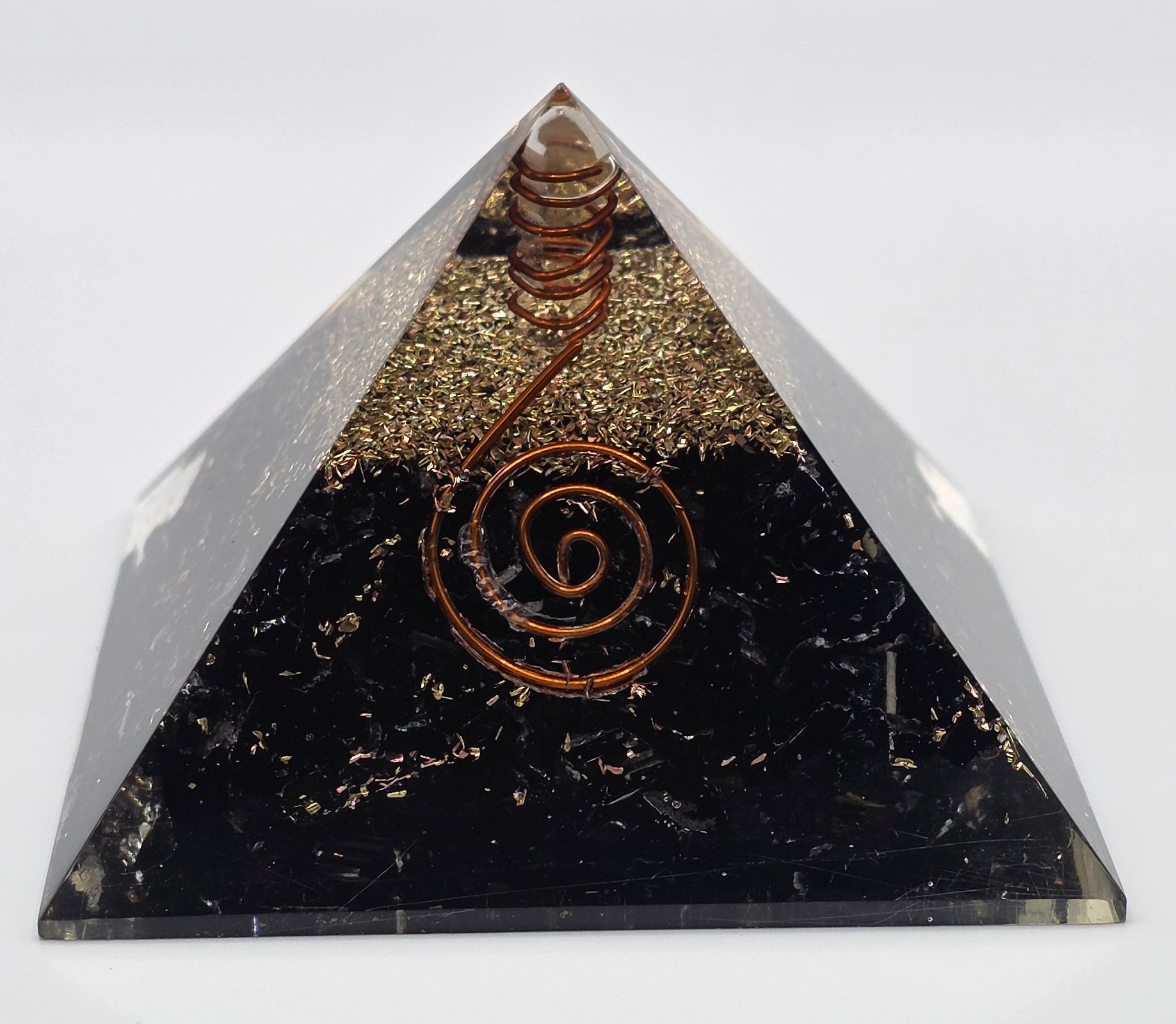 Black tourmaline orgonite pyramid 60mm front closeup showing layers – black crystal pyramid