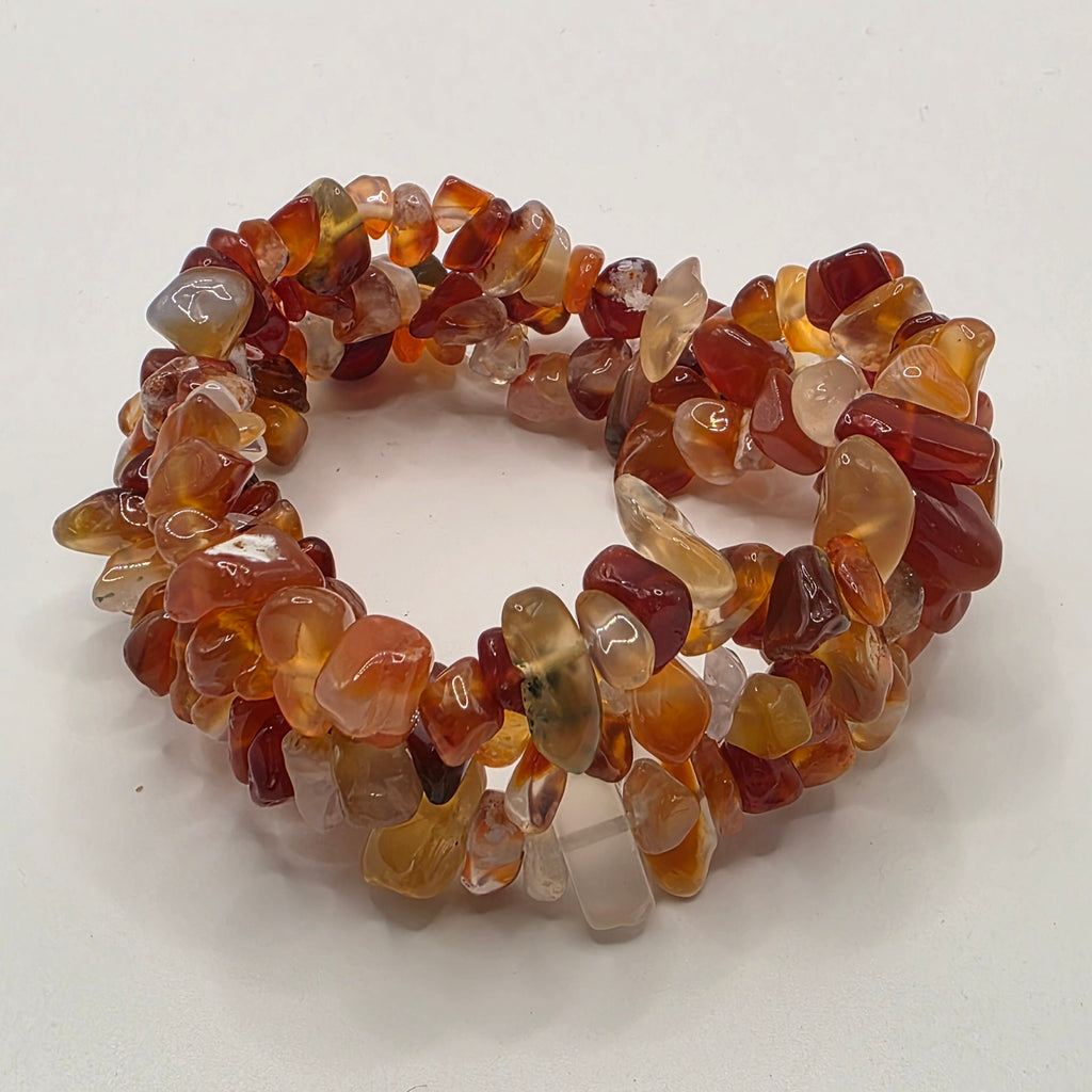 3 Carnelian chip bracelets on white background – natural orange gemstone chips for creativity and confidence