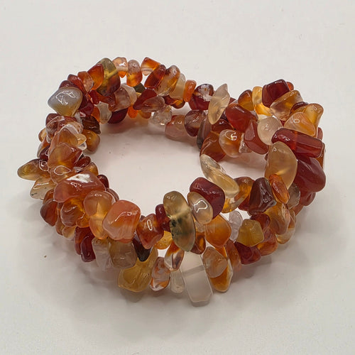 3 Carnelian chip bracelets on white background – natural orange gemstone chips for creativity and confidence