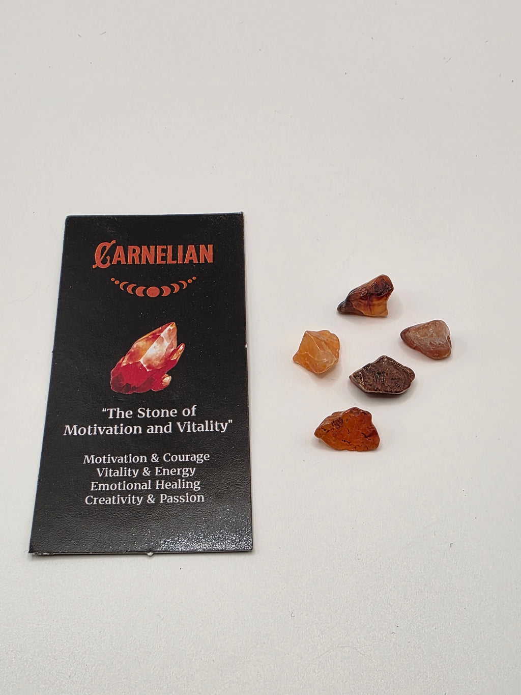 Mini carnelian crystals included with the incense – small tumbled stones for creativity and confidence