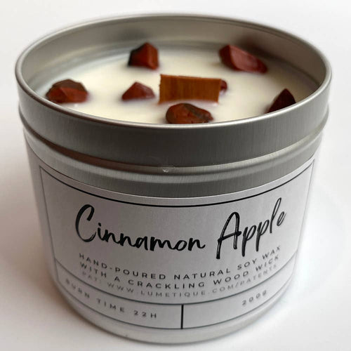 Hand-poured cinnamon apple soy wax candle with red jasper crystals and wood wick in aluminium tin