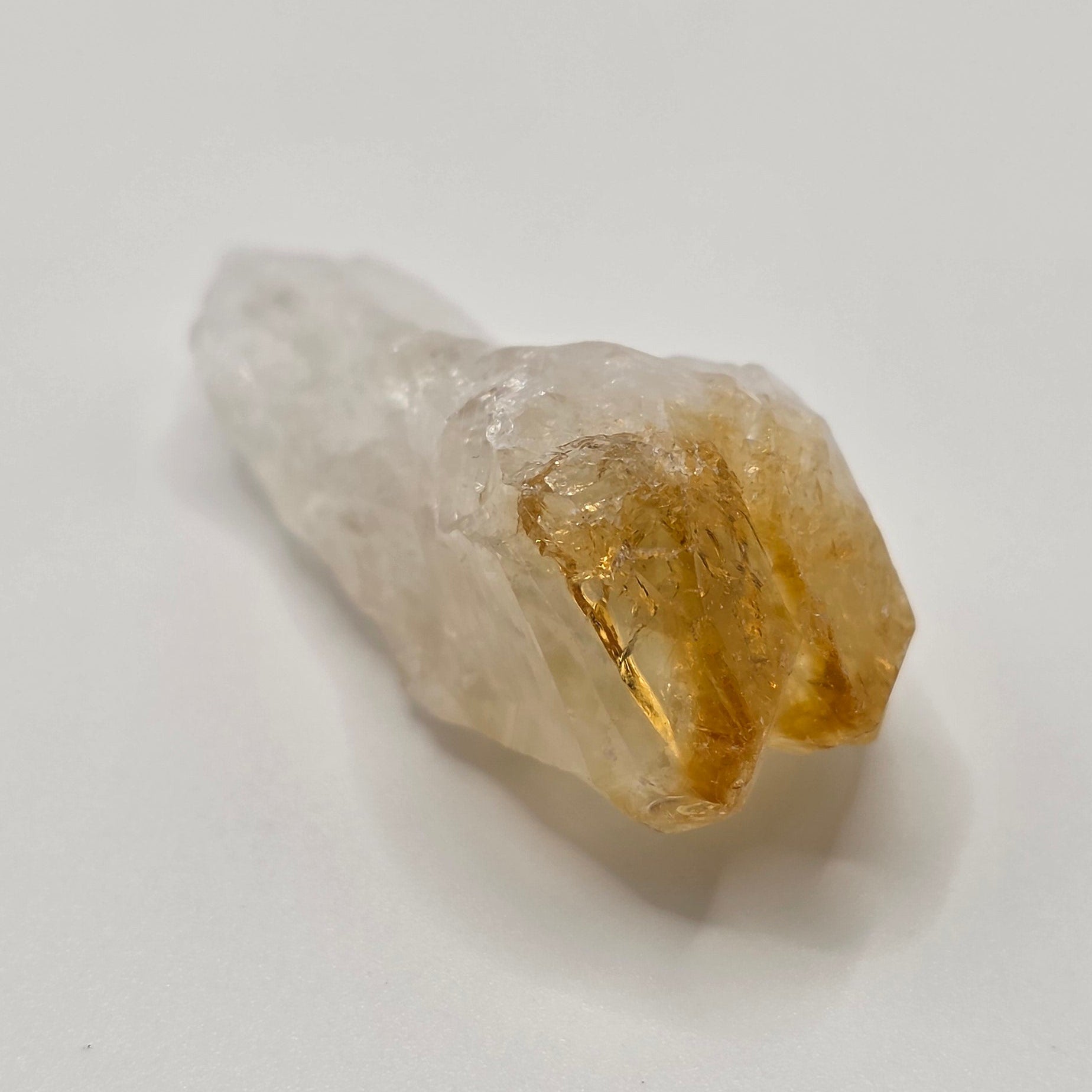 Natural citrine point crystal on white background – golden yellow Brazilian crystal tooth 2 to 3.5cm for abundance and manifestation