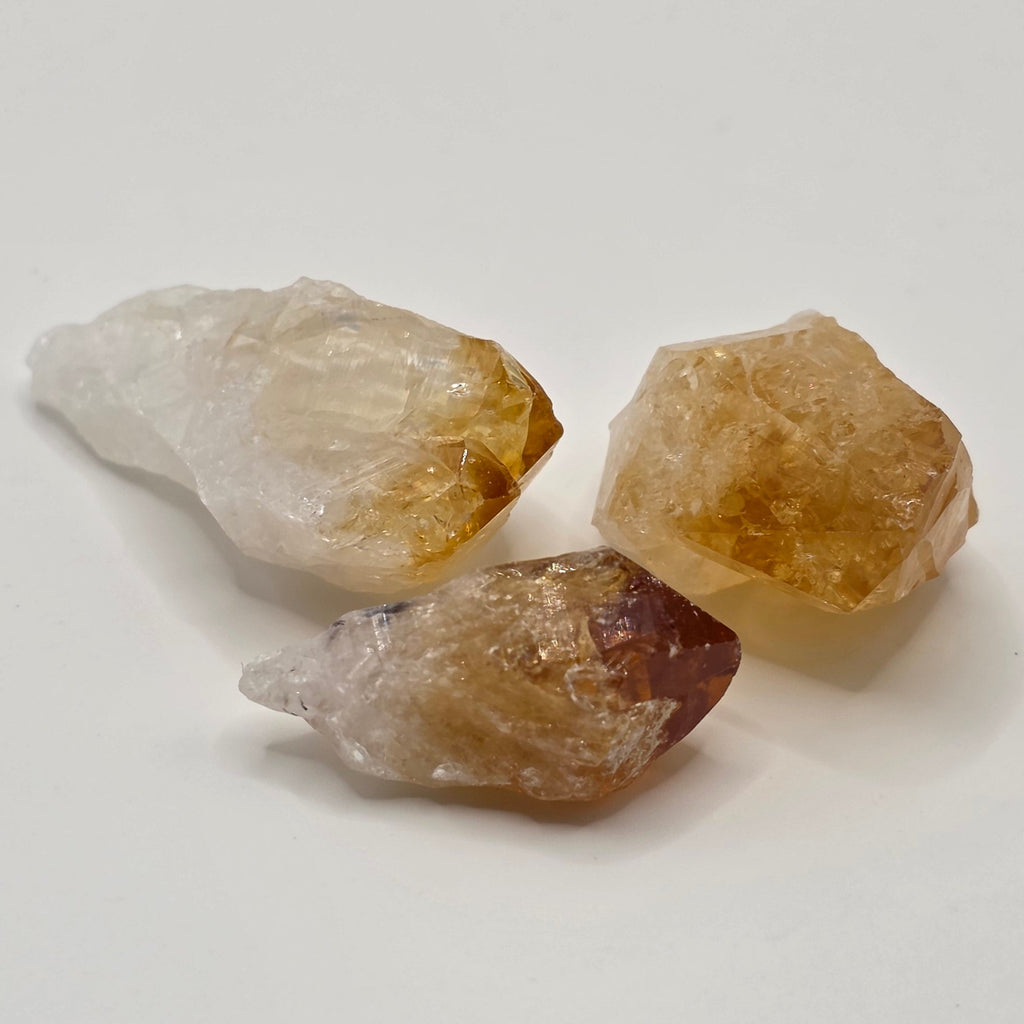 Trio of Natural citrine point crystals on white background – golden yellow Brazilian crystal tooth 2 to 3.5cm for abundance and manifestation