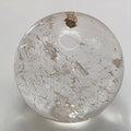 Polished 3.5cm clear quartz crystal sphere on white background