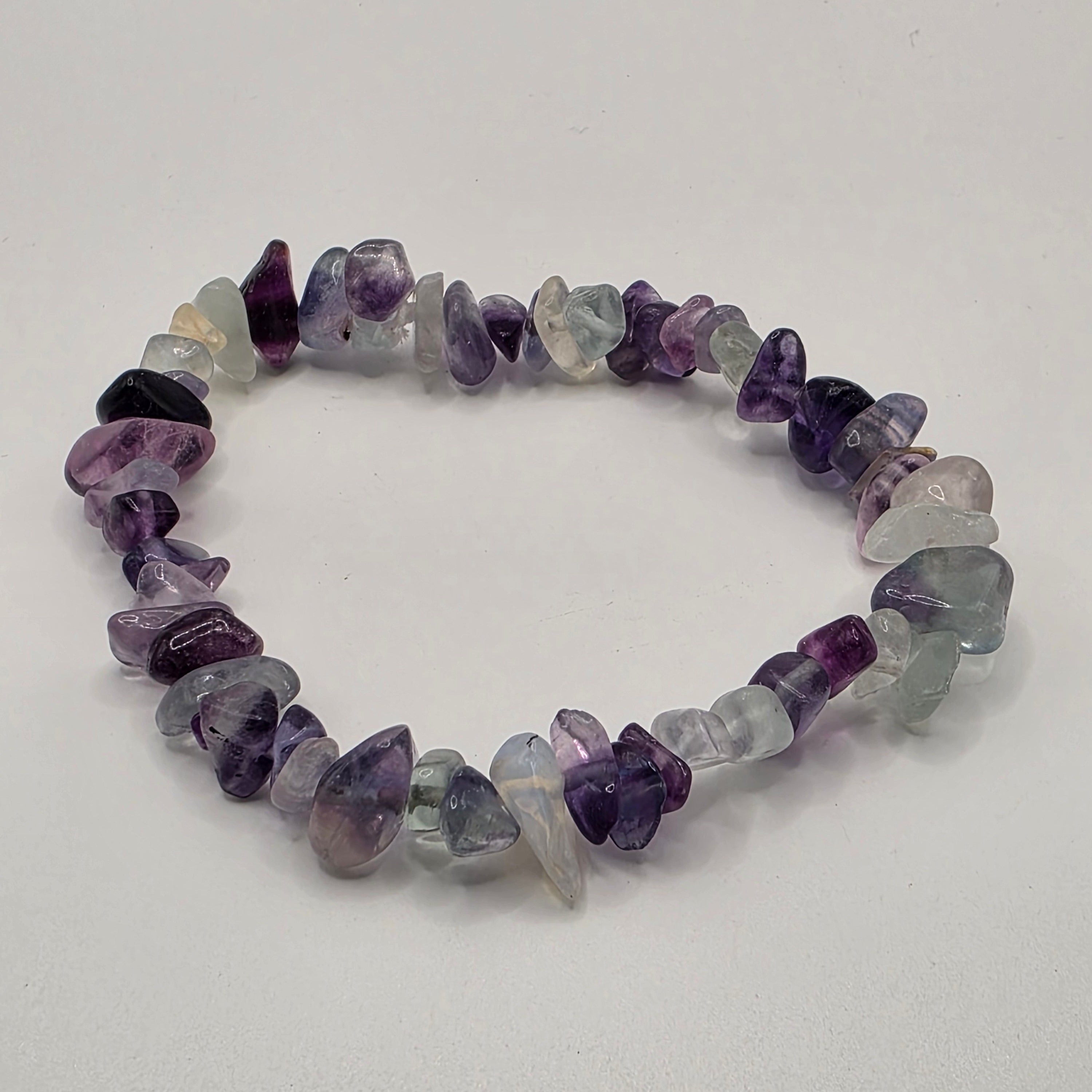 Fluorite chip bracelet on white background – natural purple and green gemstone chips for focus and mental clarity