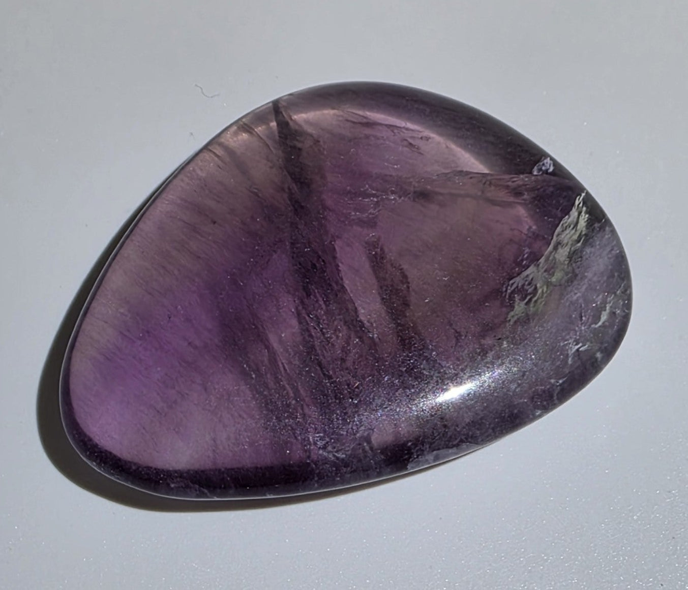 fluorite palm stone on white background