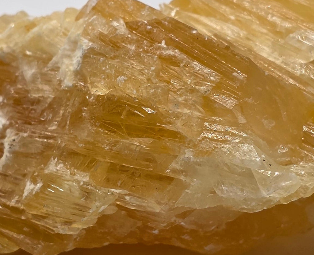 Close up of golden calcite 222g showing rich golden-orange colour – natural Afghan calcite