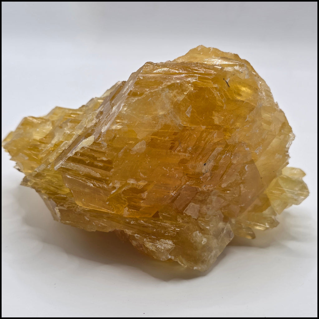 Back of golden calcite 470g showing rich golden-orange colour – natural Afghan calcite