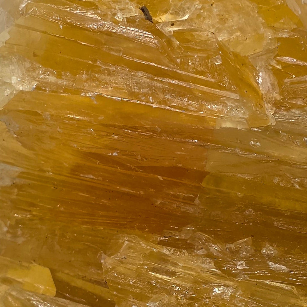Close up of golden calcite 470g showing rich golden-orange colour – natural Afghan calcite