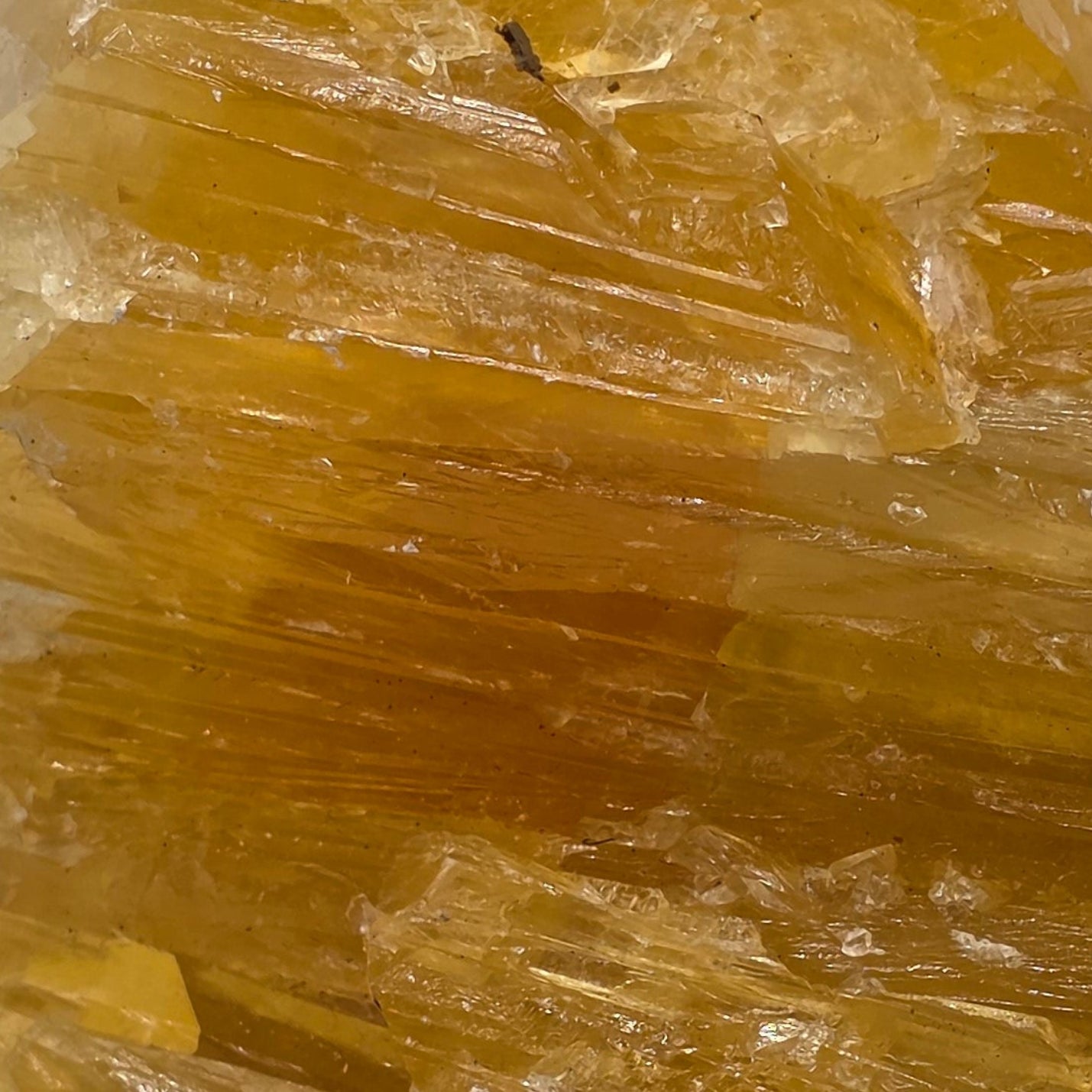 Close up of golden calcite 470g showing rich golden-orange colour – natural Afghan calcite