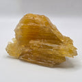 Golden calcite 470g from Afghanistan on white background – natural golden-orange crystal for abundance and manifestation