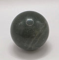 Green aventurine crystal sphere 35mm on white background – polished luck and opportunity stone