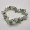 Jade chip bracelet on white background – natural green gemstone chips for good luck and harmony