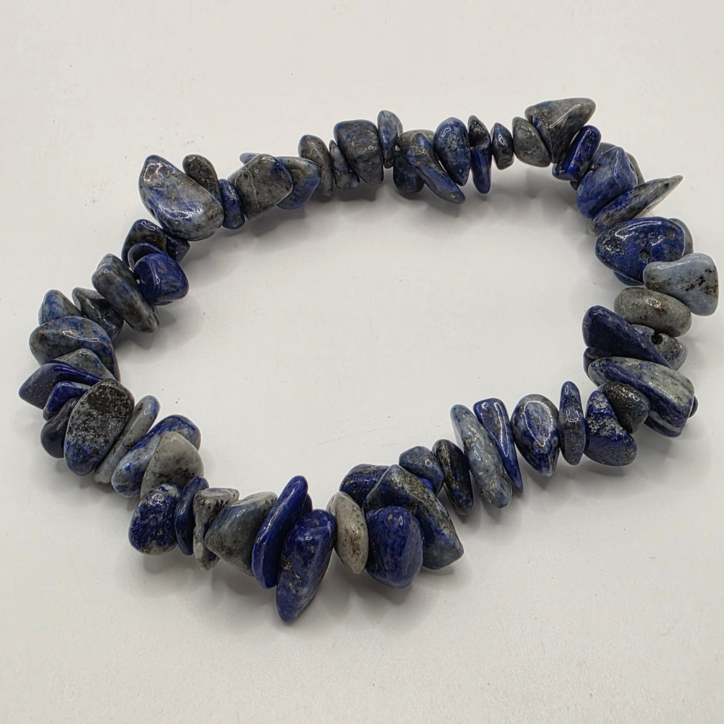 Lapis lazuli chip bracelet on white background – natural blue gemstone chips with golden pyrite flecks