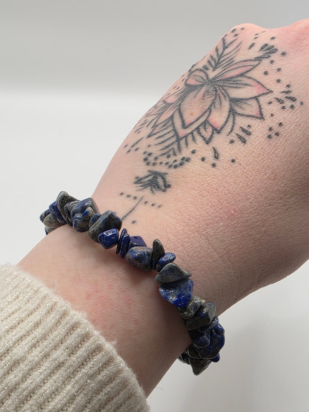 Lapis lazuli chip bracelet worn on a wrist – double strung elastic stretch bracelet for crystal healing on the go