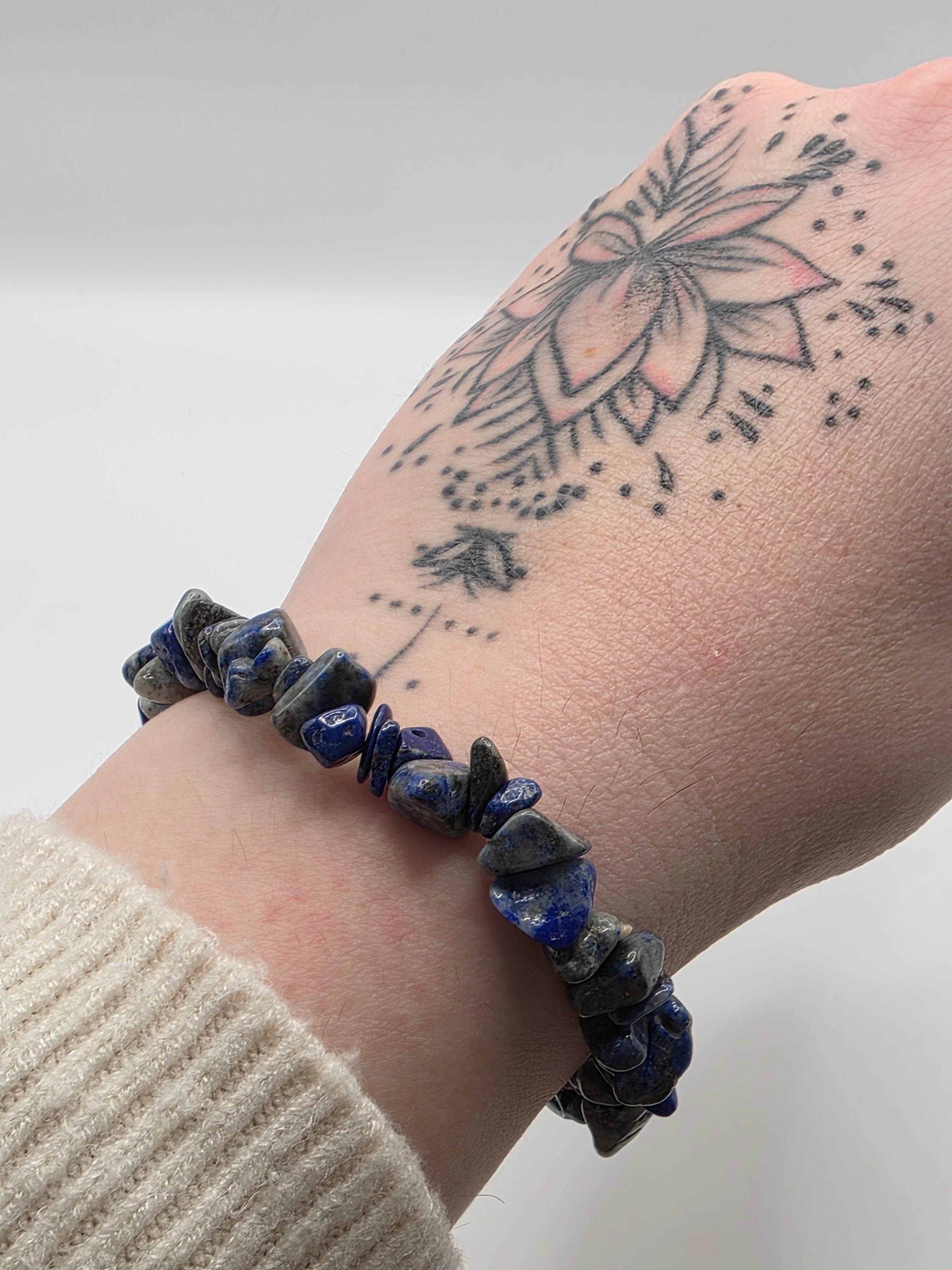 Lapis lazuli chip bracelet worn on a wrist – double strung elastic stretch bracelet for crystal healing on the go