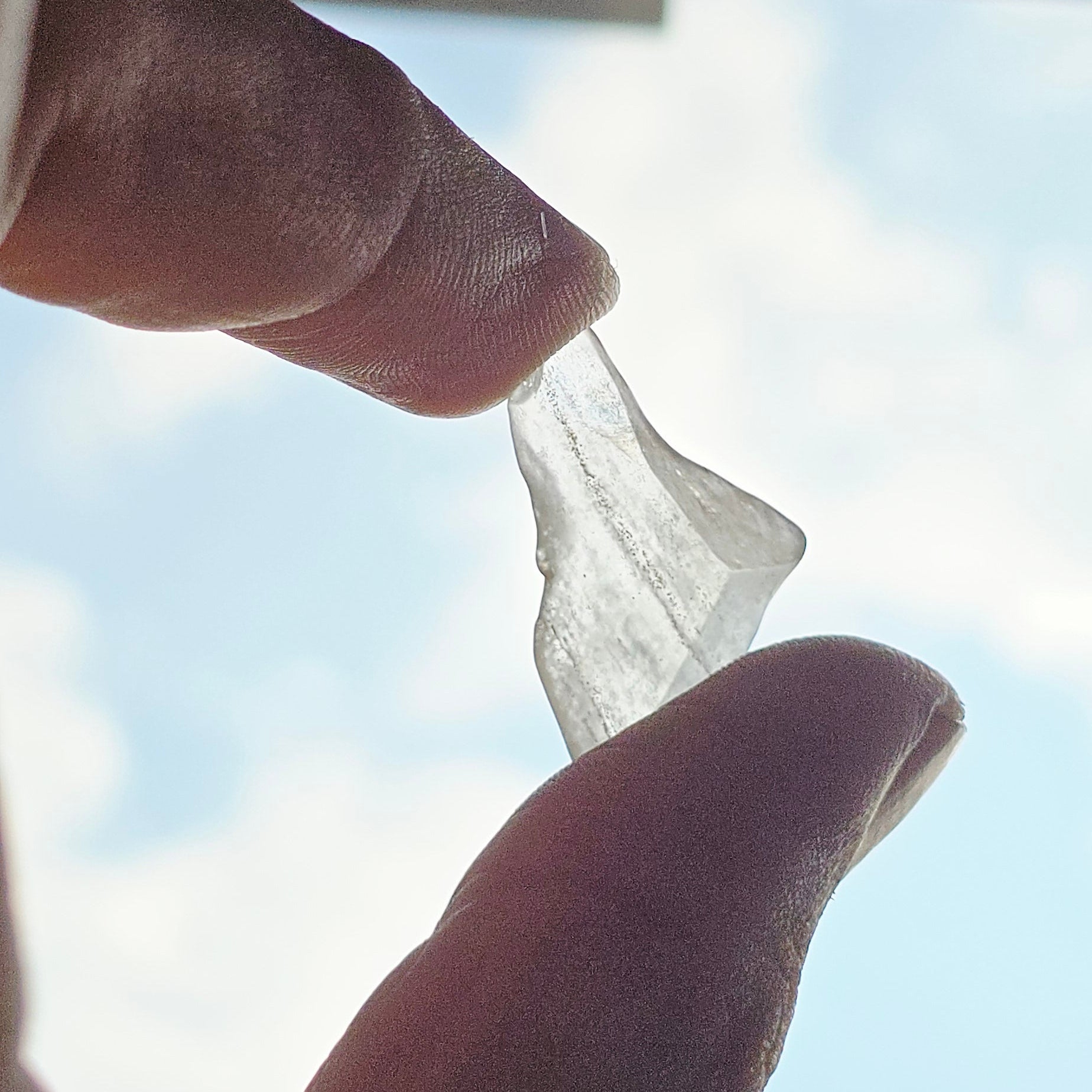 Libyan Desert Glass in natural light showing golden translucency