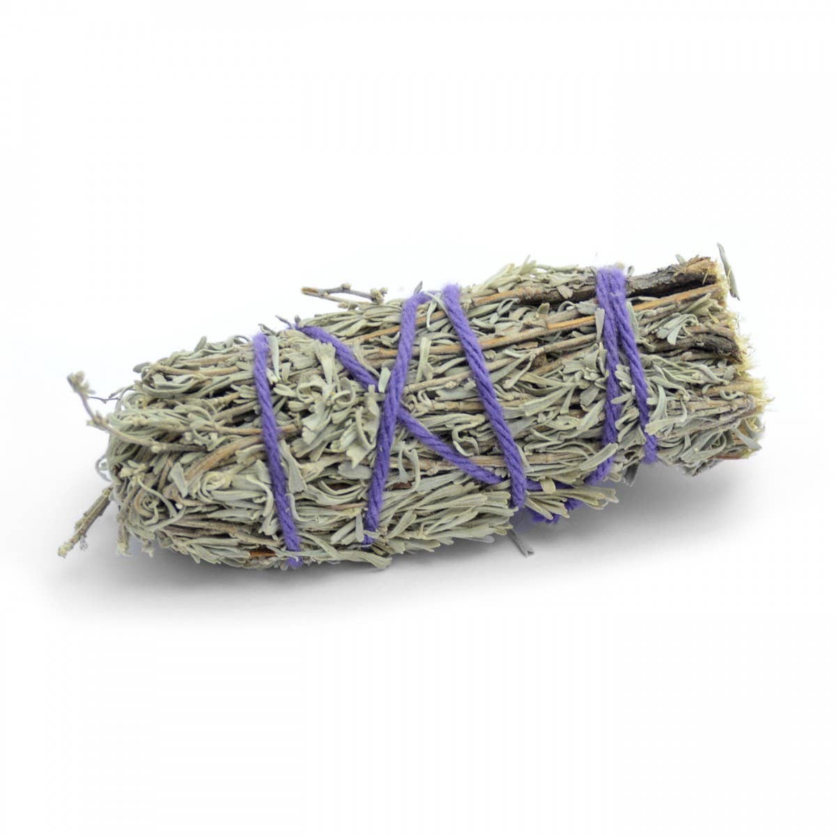 Bundled sage with purple string on a white background
