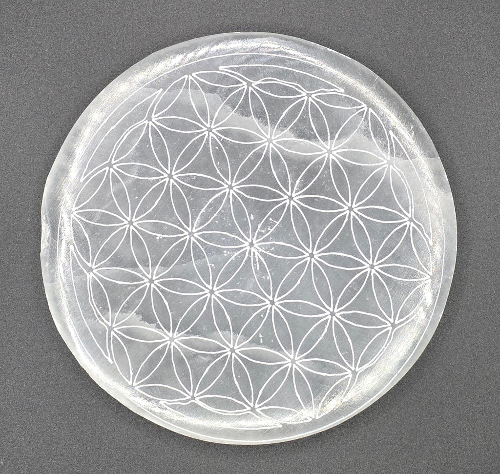 Birdseye View of selenite charging plate showing Flower of Life sacred geometry engraving – natural white selenite