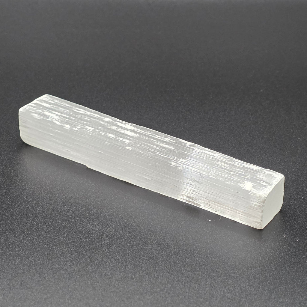 Natural selenite wand 10cm on Black background – white healing crystal wand for cleansing and energy clearing