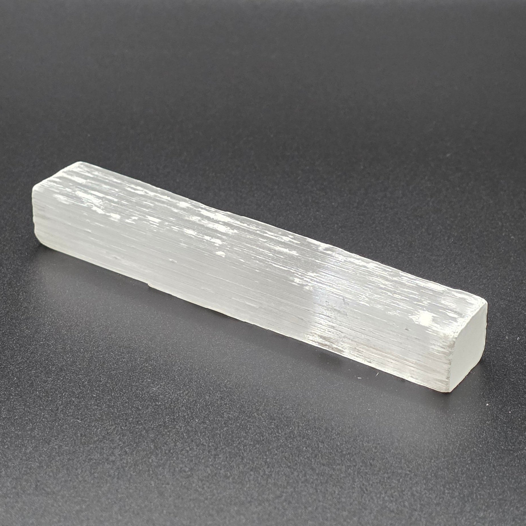 Natural selenite wand 10cm on Black background – white healing crystal wand for cleansing and energy clearing