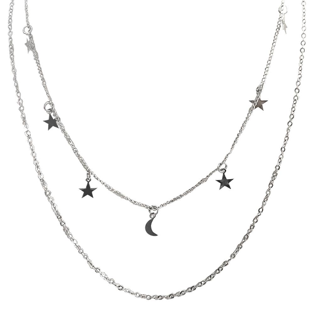Layered silver necklace with star and moon pendants on a white background