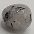 Tourmaline in quartz tumbled stone on white background – clear quartz with black tourmaline needles – 2-3cm polished stone