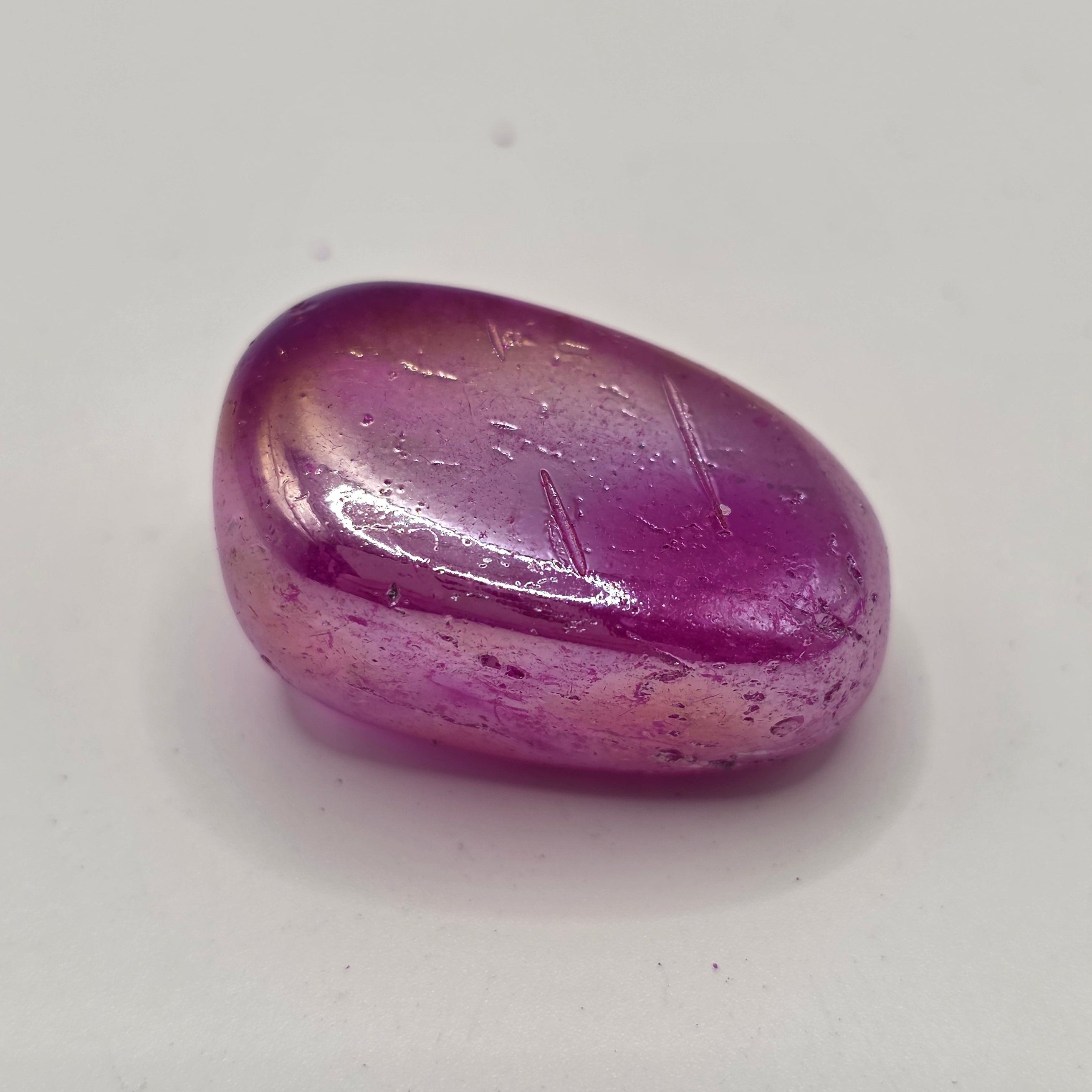 Witch aura tumbled stone on white background – iridescent rainbow sheen crystal, 15-25mm