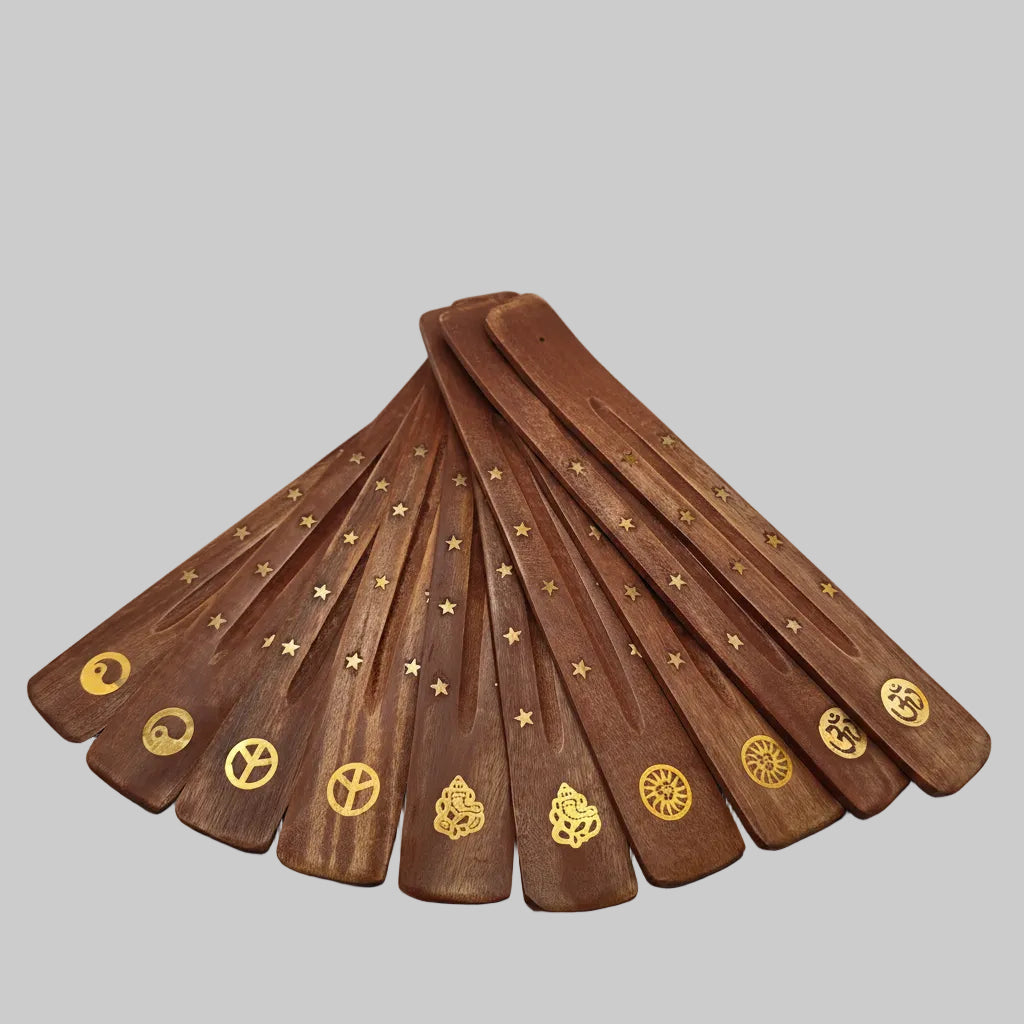 Set of wooden ashcatchers with gold symbols on a gray background